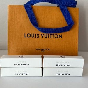 4 authentic Louis Vuitton travel sprays, new and sealed, shopping bag included